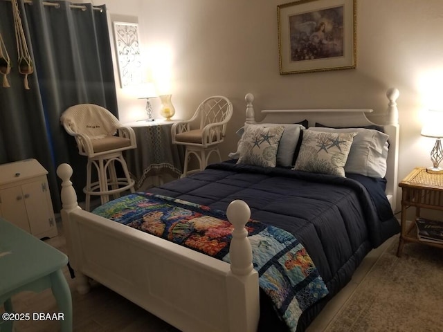 bedroom with wood finished floors