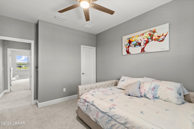 carpeted bedroom with ceiling fan