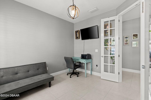 office featuring an inviting chandelier and light tile patterned floors