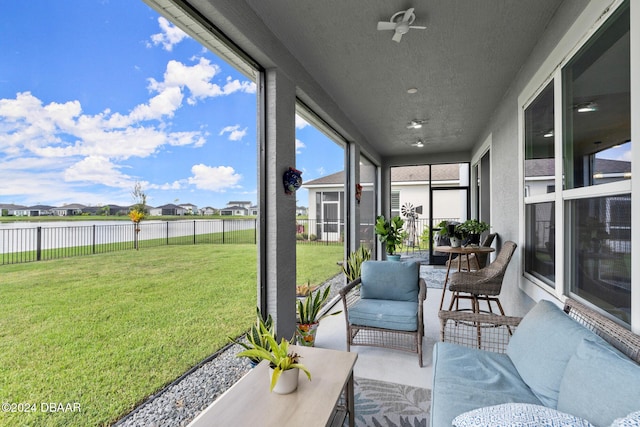 137 Azure Mist Way, Daytona Beach, FL 32124 - sunroom featuring a water view, a residential view, and a ceiling fan