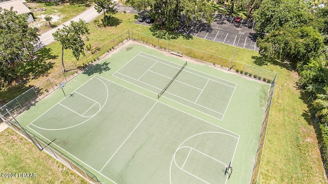 view of basketball court featuring a lawn