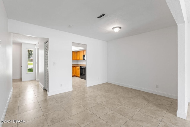 view of tiled spare room