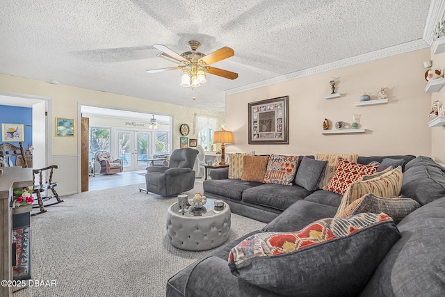 living room featuring crown molding, carpet floors, a textured ceiling, and french doors