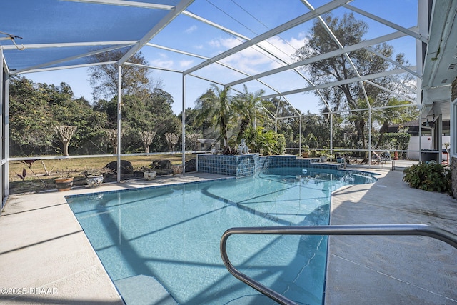 view of swimming pool with a patio area and glass enclosure