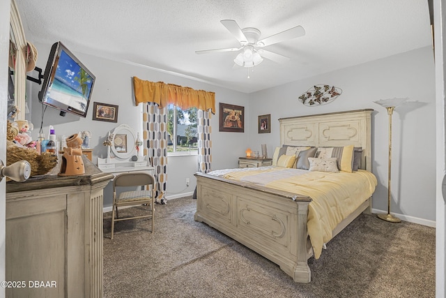 bedroom with ceiling fan, carpet floors, and a textured ceiling