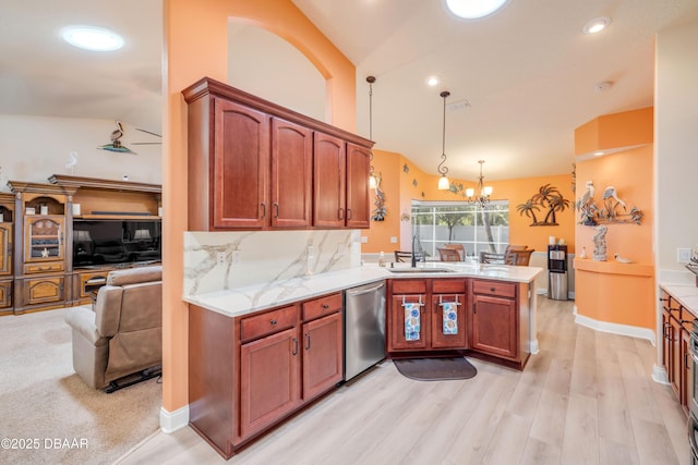 406 Phillips Creek Ln, New Smyrna Beach, FL 32168 - kitchen with dishwasher, a peninsula, lofted ceiling, light wood-style floors, and a chandelier