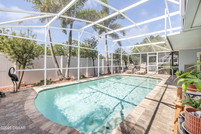 406 Phillips Creek Ln, New Smyrna Beach, FL 32168 - view of pool with a patio, a fenced backyard, and glass enclosure