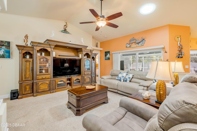 406 Phillips Creek Ln, New Smyrna Beach, FL 32168 - living area featuring a ceiling fan, vaulted ceiling, and carpet flooring
