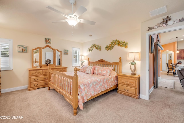 406 Phillips Creek Ln, New Smyrna Beach, FL 32168 - bedroom featuring light carpet, arched walkways, and ceiling fan