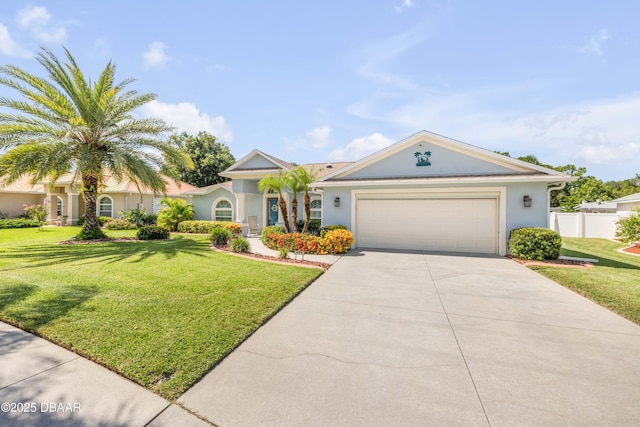 406 Phillips Creek Ln, New Smyrna Beach, FL 32168 - view of front of property with concrete driveway, stucco siding, and an attached garage