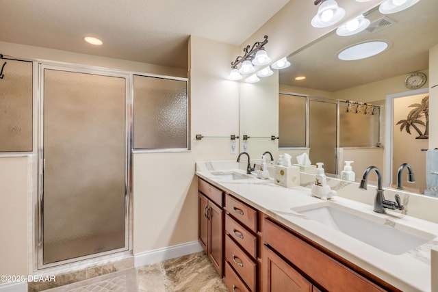 406 Phillips Creek Ln, New Smyrna Beach, FL 32168 - full bathroom with double vanity, a shower stall, and recessed lighting