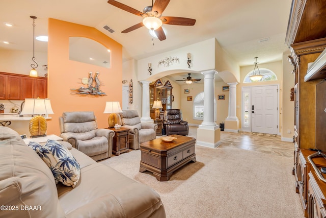406 Phillips Creek Ln, New Smyrna Beach, FL 32168 - living area with decorative columns, a ceiling fan, arched walkways, light carpet, and vaulted ceiling