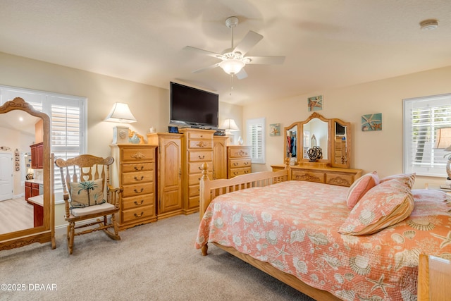 406 Phillips Creek Ln, New Smyrna Beach, FL 32168 - bedroom featuring light carpet and ceiling fan