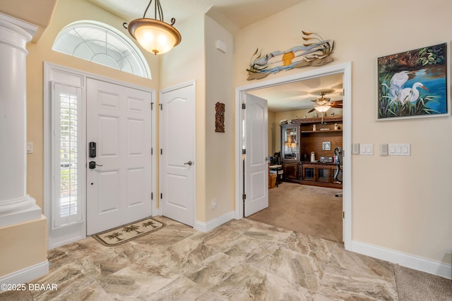 406 Phillips Creek Ln, New Smyrna Beach, FL 32168 - entrance foyer with ornate columns, a towering ceiling, and ceiling fan