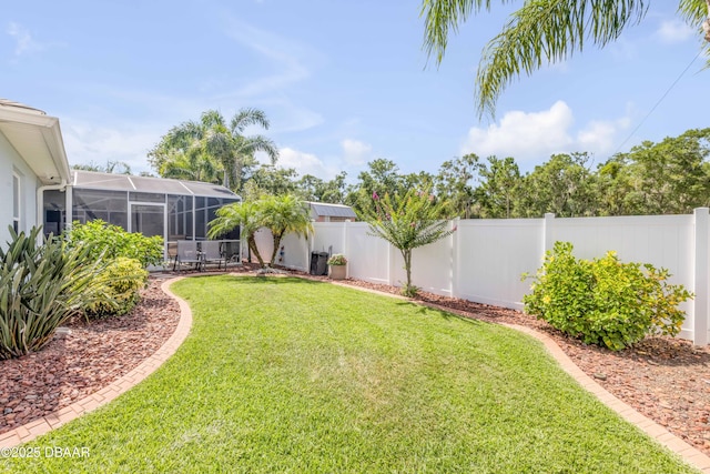 406 Phillips Creek Ln, New Smyrna Beach, FL 32168 - fenced backyard featuring a lanai