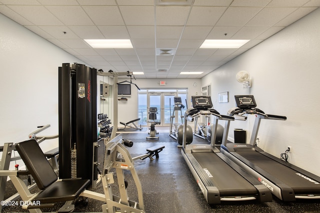 workout area featuring a paneled ceiling