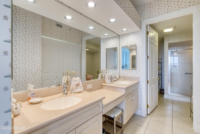 bathroom featuring tile patterned flooring, vanity, and a shower with shower door