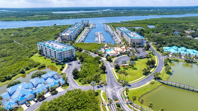 birds eye view of property with a water view