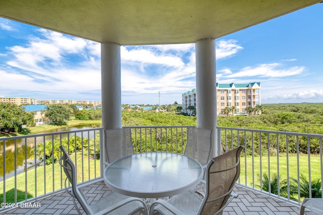 balcony featuring a water view