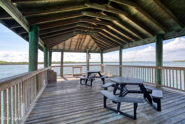 dock area featuring a gazebo and a deck with water view