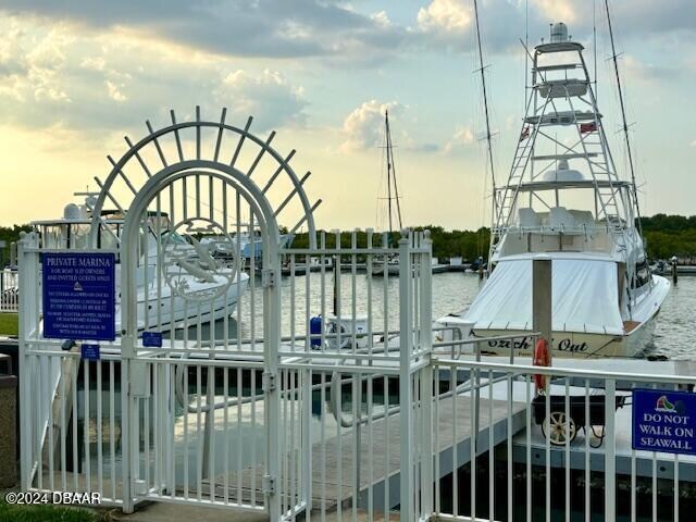 gate at dusk with a water view