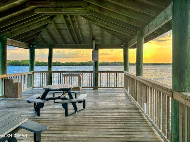 dock area with a gazebo and a water view