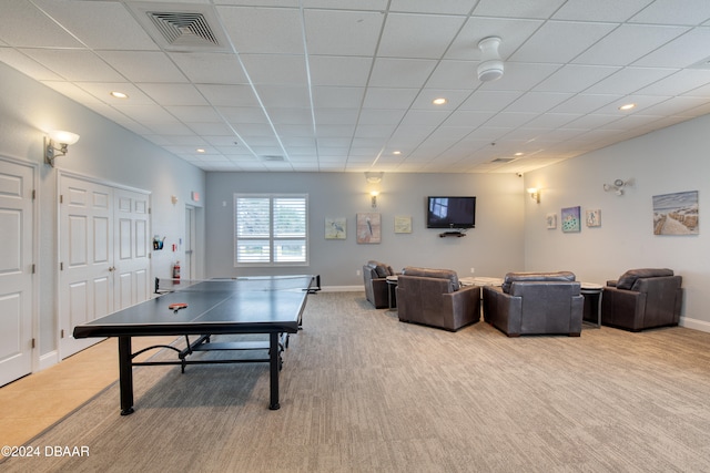 playroom featuring a drop ceiling and light carpet