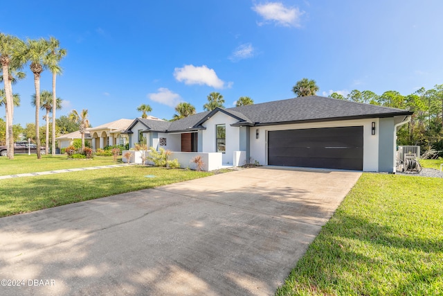 ranch-style home featuring a front yard and a garage