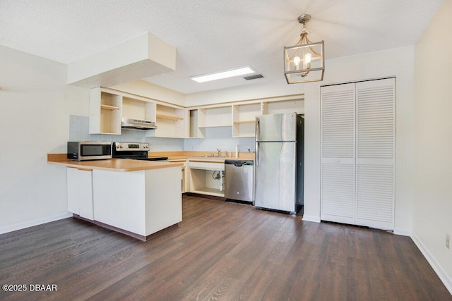 kitchen featuring under cabinet range hood, a peninsula, visible vents, appliances with stainless steel finishes, and open shelves