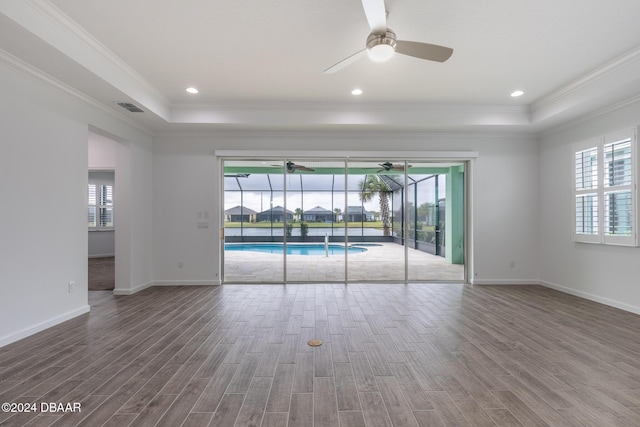 544 Good Life Way, Daytona Beach, FL 32124 - spare room featuring healthy amount of natural light, ceiling fan, wood finished floors, and ornamental molding