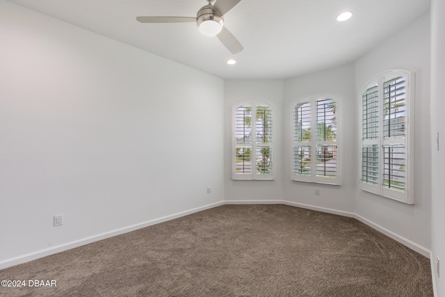 544 Good Life Way, Daytona Beach, FL 32124 - unfurnished room featuring dark colored carpet, healthy amount of natural light, a ceiling fan, baseboards, and recessed lighting