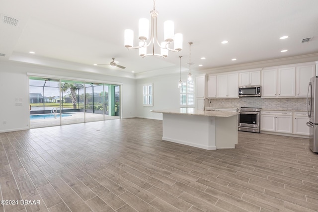 544 Good Life Way, Daytona Beach, FL 32124 - kitchen with stainless steel appliances, open floor plan, baseboards, backsplash, and recessed lighting