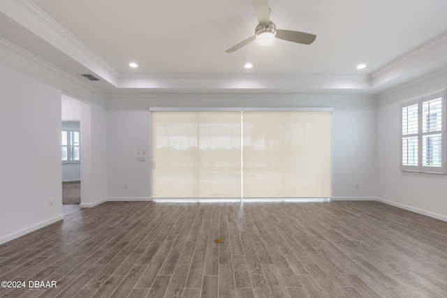 544 Good Life Way, Daytona Beach, FL 32124 - empty room with a tray ceiling, crown molding, wood finished floors, and ceiling fan
