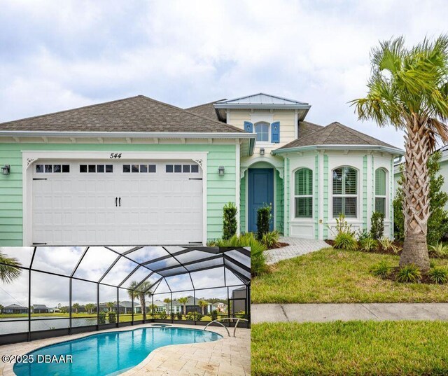 view of front of home with a front yard and a garage