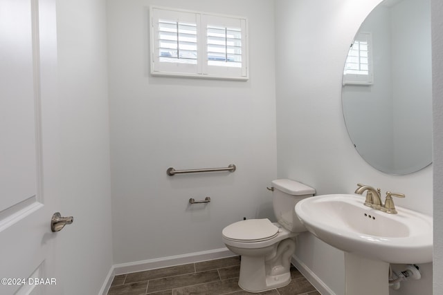 544 Good Life Way, Daytona Beach, FL 32124 - bathroom with healthy amount of natural light, toilet, and baseboards