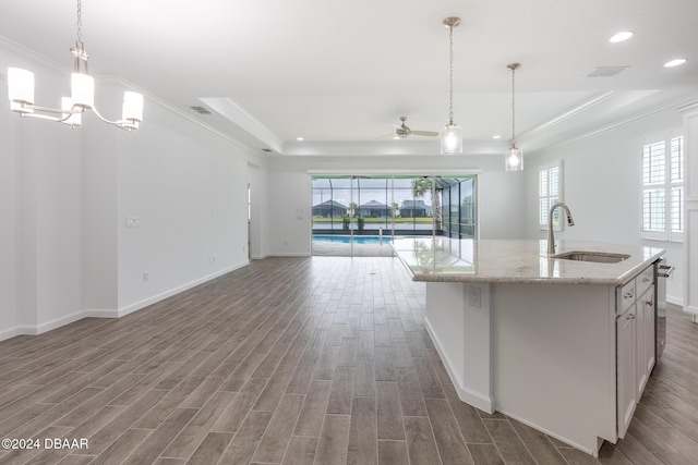 544 Good Life Way, Daytona Beach, FL 32124 - kitchen with a sink, a raised ceiling, crown molding, open floor plan, and ceiling fan