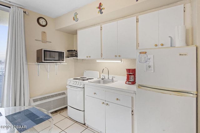 1233 S Atlantic Ave Unit 2270, Daytona Beach, FL 32118 - kitchen with white appliances, a sink, white cabinets, and light countertops