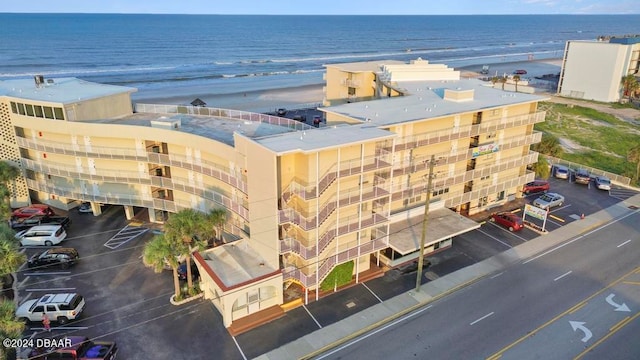 aerial view with a beach view and a water view