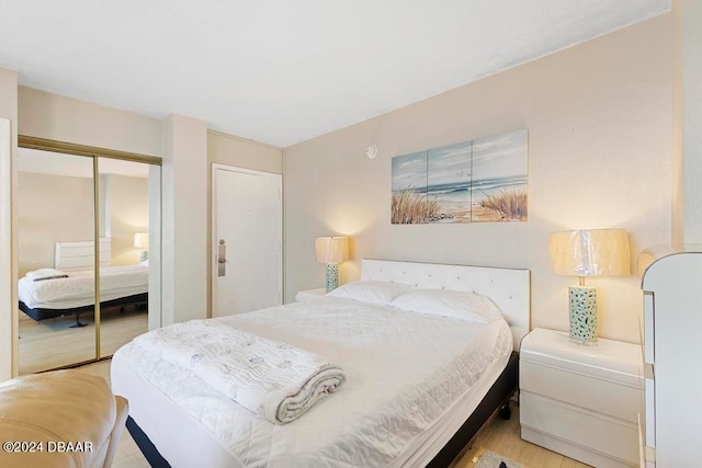 bedroom featuring a closet and light hardwood / wood-style floors