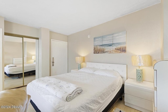 1233 S Atlantic Ave Unit 2270, Daytona Beach, FL 32118 - bedroom with light wood-style flooring and a closet