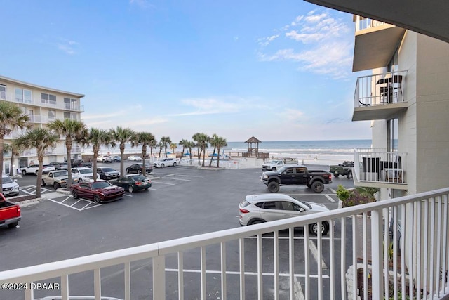 view of parking with a water view