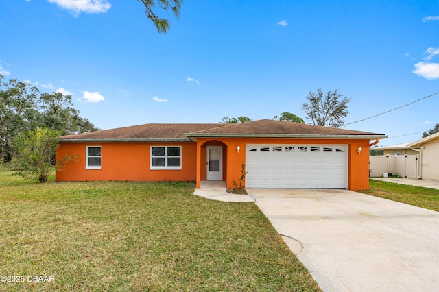 ranch-style house with a garage and a front lawn