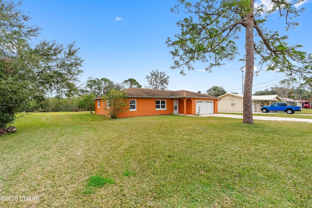 view of front of property featuring a garage and a front yard