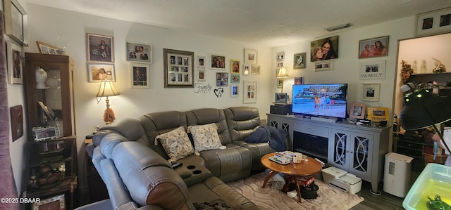 living room with visible vents and dark wood finished floors