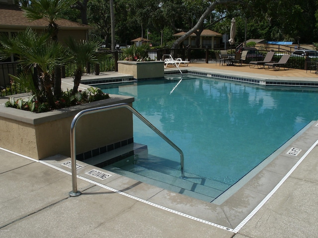 view of swimming pool featuring a patio area