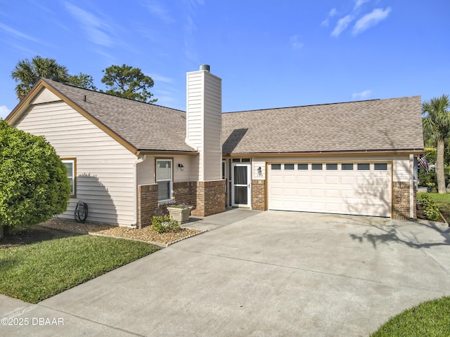 ranch-style home featuring brick siding, a chimney, a shingled roof, a garage, and driveway