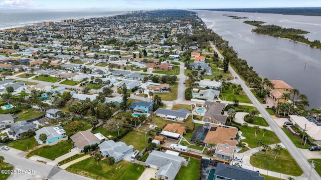 birds eye view of property featuring a water view and a residential view