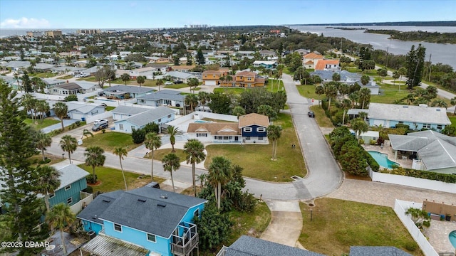 birds eye view of property featuring a residential view and a water view