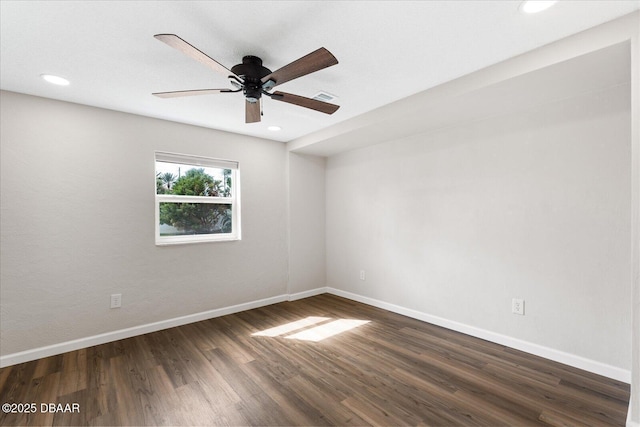 spare room with dark wood-style flooring, recessed lighting, visible vents, a ceiling fan, and baseboards