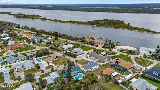 bird's eye view with a water view and a residential view